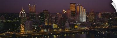 High angle view of buildings lit up at night, Pittsburgh, Pennsylvania