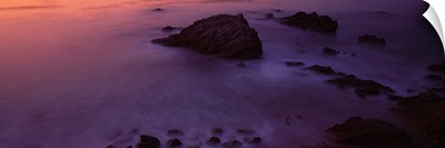 High angle view of rocks in the sea at dusk, Leo Carillo State Park, Malibu, California