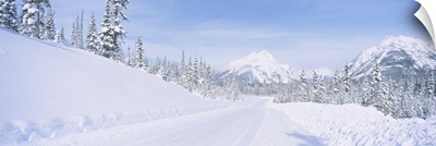 Highway passing through a snow covered landscape, Alberta, Canada