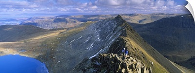 Hikers hiking on a mountain, Striding Edge, Helvellyn, English Lake District, Cumbria, England