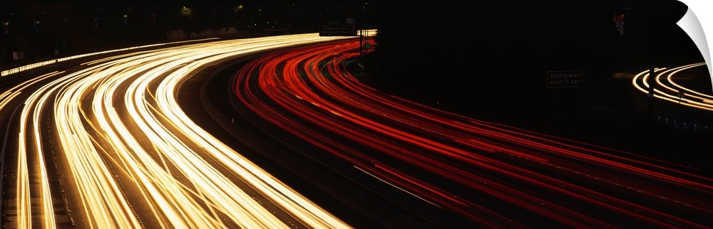Trails of car lights on the busy Hollywood Freeway in the evening in California.