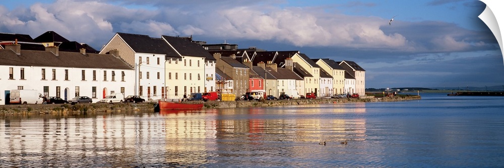 Long horizontal photo print of colorful Irish buildings and houses along the waterfront.