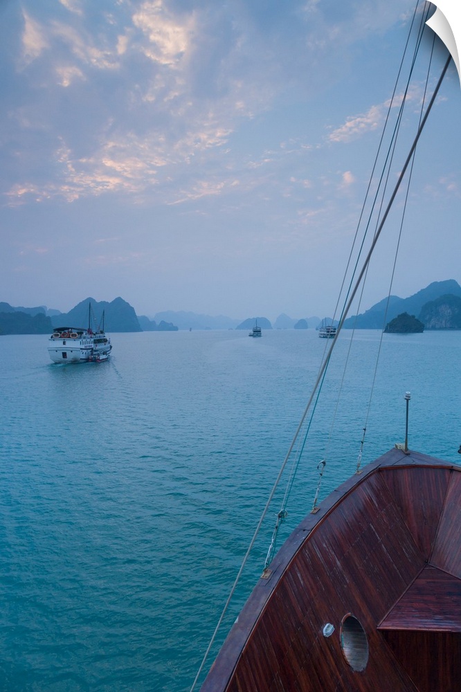 Islands and boat in the pacific ocean, ha long bay, quang ninh province, vietnam.