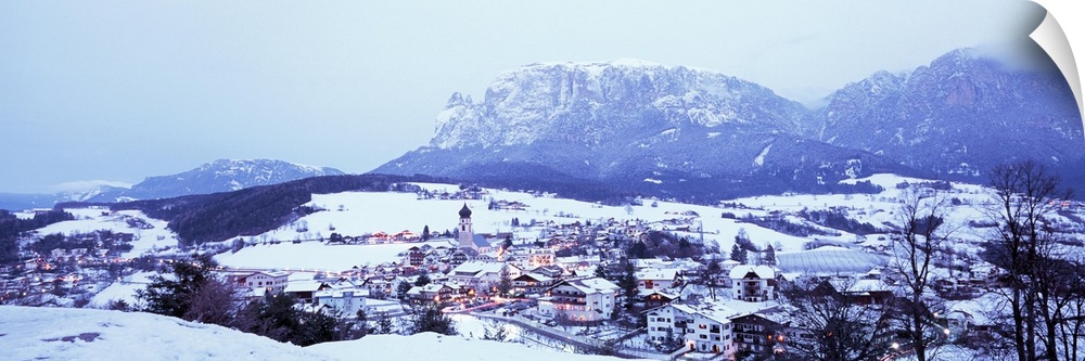 Italy, Fie, Italian Alps, High angle view of town covered with snow