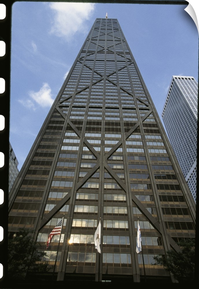 Vertical photograph from below of the Hancock building during the day in Chicago, Illinois.