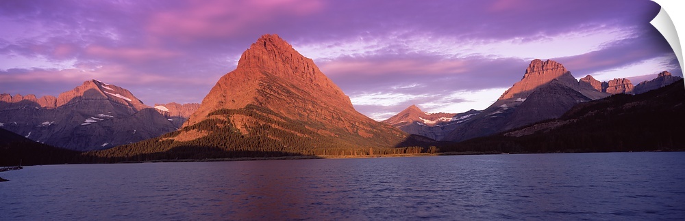 Lake with mountains at dusk, Swiftcurrent Lake, Many Glacier, US Glacier National Park, Montana,