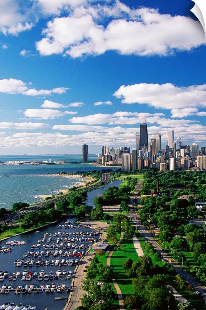 A vertical cityscape photograph of the urban areas along Lake Michigan.