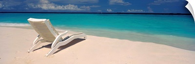 Lounge chair on the beach, Thulhagiri Island Resort, North Male Atoll, Maldives