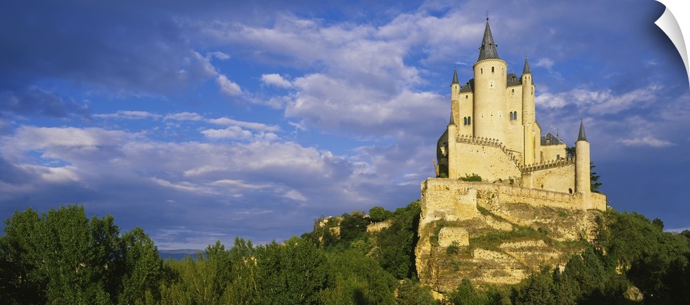 Low angle view of a castle on a hill, The Alcazar Castle, Alcazar, Segovia, Castilla y Leon, Spain