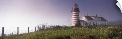 Low angle view of a lighthouse, West Quoddy Head lighthouse, Lubec, Washington County, Maine,