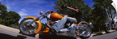 Low angle view of a man riding a motorcycle, Wisconsin
