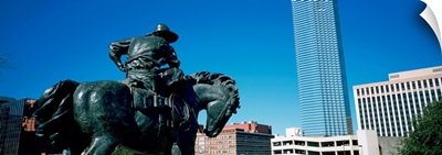 Low angle view of a statue in front of buildings, Dallas, Texas