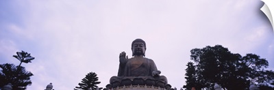 Low angle view of a statue of Buddha, Po Lin Monastery, Lantau Island, New Territories, Hong Kong, China
