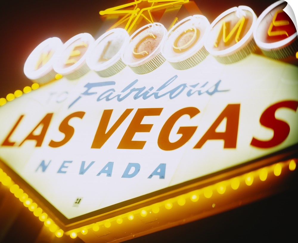 Large photograph focuses on a close-up of the famous neon sign somebody can see as they enter the nicknamed ""Sin City"" l...