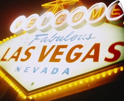 Low angle view of a welcome sign lit up at night, Las Vegas, Nevada