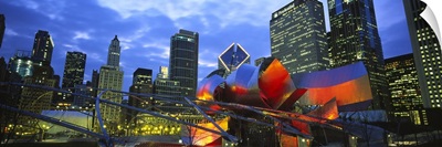 Low angle view of buildings lit up at night, Millennium Park, Chicago, Illinois