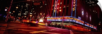 Low angle view of buildings lit up at night, Radio City Music Hall, Rockefeller Center, Manhattan, New York City, New York State