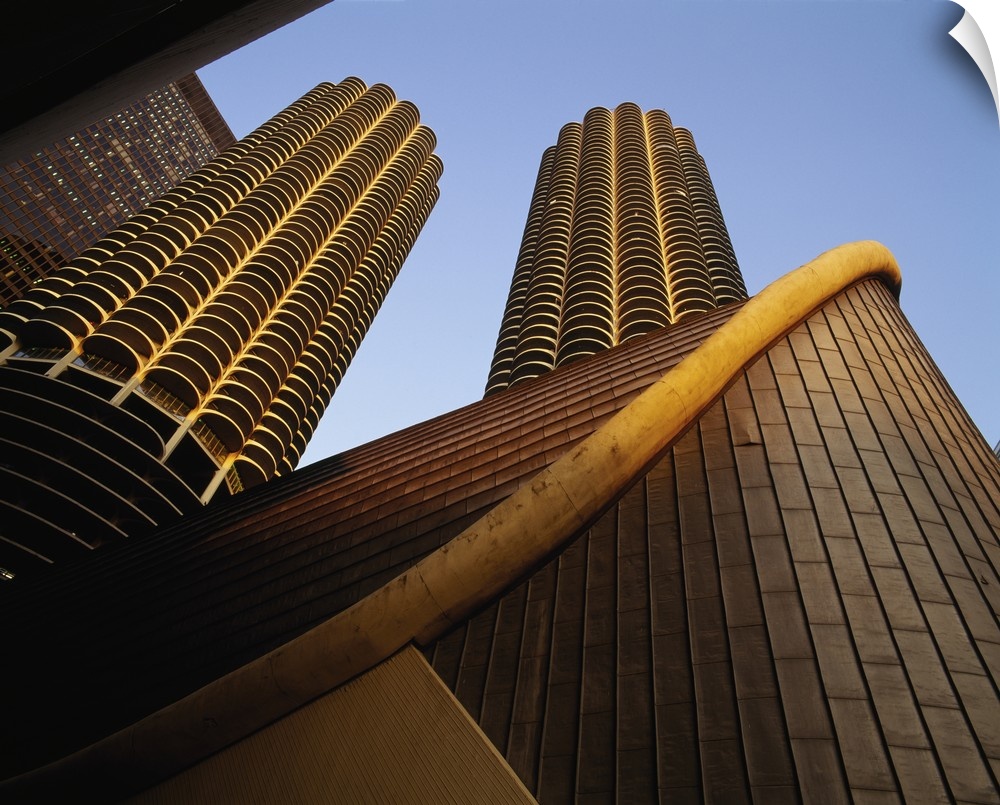 Large photo on canvas of tall buildings seen from below looking up.