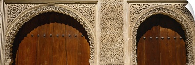 Low angle view of carving on arches of a palace, Court Of Lions, Alhambra, Granada, Andalusia, Spain