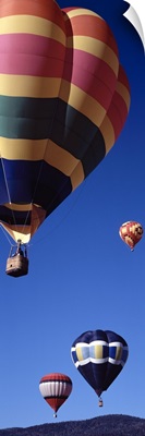 Low angle view of hot air balloons flying in the sky, Angel Fire, New Mexico