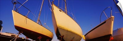 Low angle view of sailboats in dry dock, Boston Harbor, Boston, Massachusetts