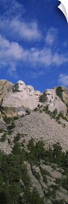 Low angle view of sculptures of US presidents carved on the rocks of a mountain, Mt Rushmore National Monument, South Dakota