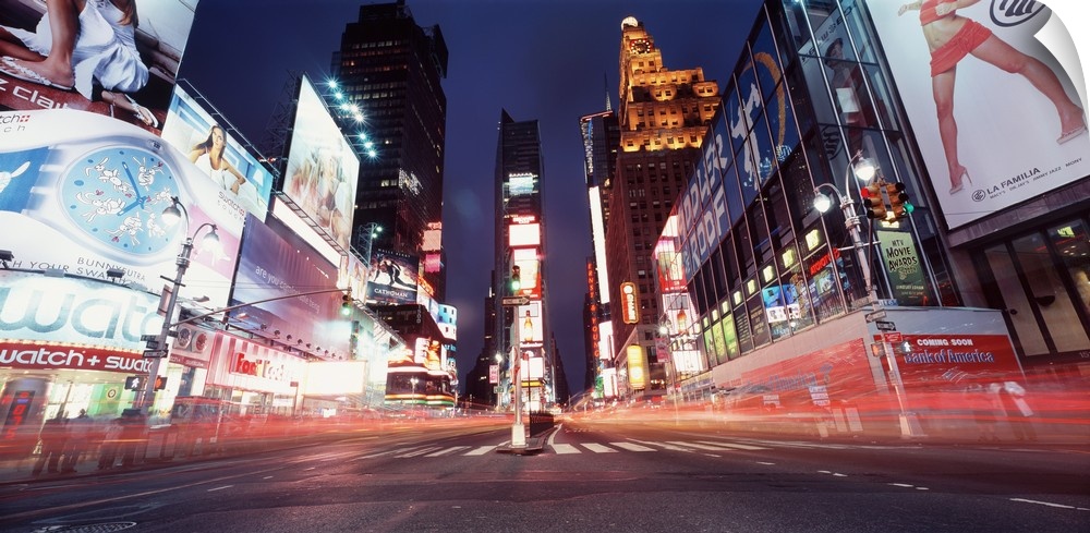 Low-angle panorama of the lights of Times Square in downtown New York City.