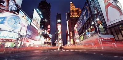 Low angle view of sign boards lit up at night, Times Square, New York City, New York