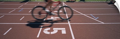 Low section view of a man cycling on sports track, Kirchzarten, Germany