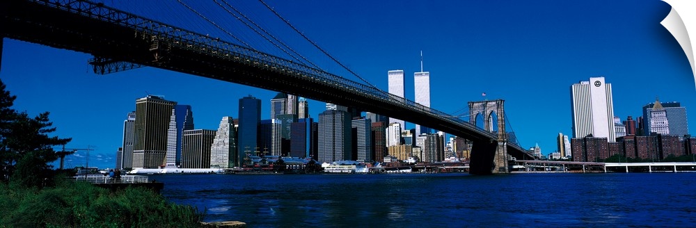 Panoramic photo print of the Brooklyn Bridge that leads towards the skyline of downtown New York City including the World ...