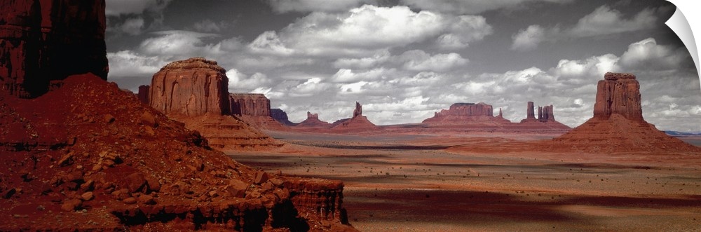 Selective color photograph of the Arizona desert landscape. The rocky landscape remains in color under a black and white sky.