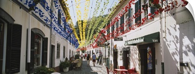 Multi-colored streamers hanging over a street, Sao Vicente, Madeira, Portugal