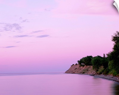 New York, Sodus Bay, Chimney Bluffs State Park, Lake Ontario, Sunset over a lake