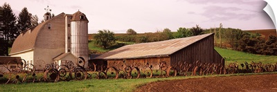 Old barn with a fence made of wheels, Palouse, Whitman County, Washington State,