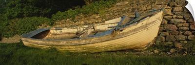 Old fishing boat in front of a stone wall, Westport, County Mayo, Republic of Ireland