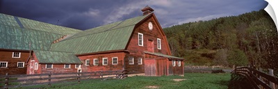 Old red barn with green rooftops in a farm, Vermont,