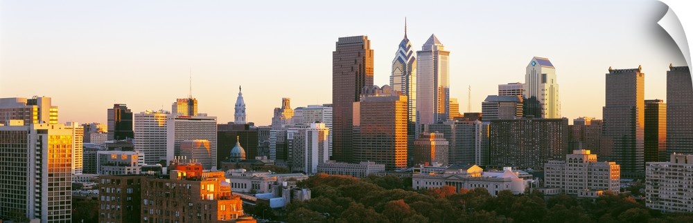 Giant, panoramic photograph of the sun shining on the skyline of Philadelphia.