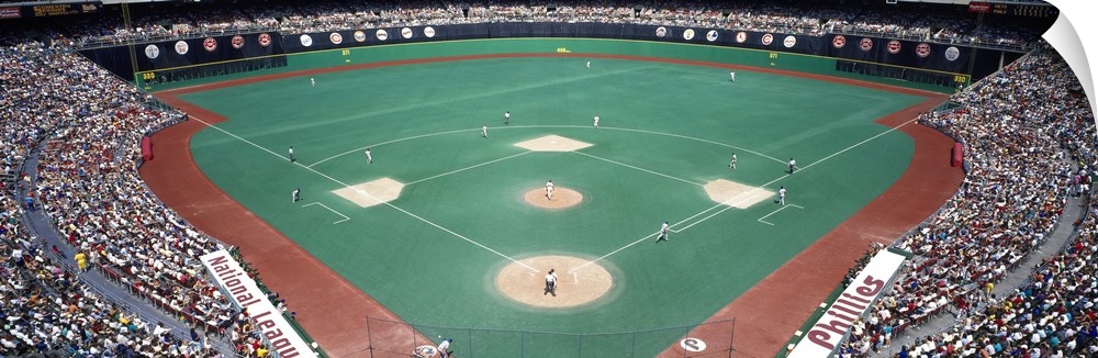 Wide angle photograph of Veterans Stadium in Pennsylvania.  The stands are packed with fans during a Phillies versus Mets ...