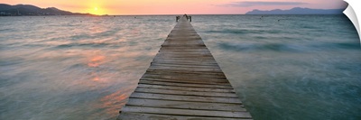 Pier at sunset in the sea, Alcudia, Majorca, Spain