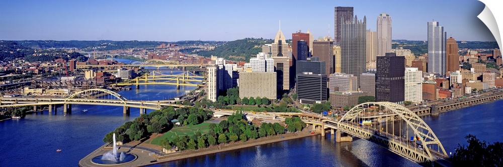 Panoramic photograph of the skyline, bridges, and Point State Park where the three rivers meet.