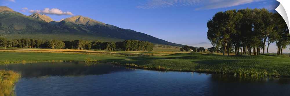 Pond in a golf course with mountains in the background, Former Great Sand Dunes Country Club, Great Sand Dunes National Mo...