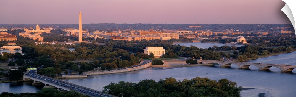 Large panoramic photo art of the major monuments that make up the capitol of the United States at sunrise.