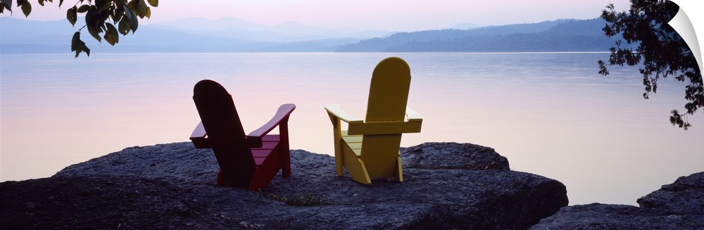 Horizontal photograph on a big canvas of two adirondack chairs sitting at the edge of a rocky cliff, overlooking the calm ...