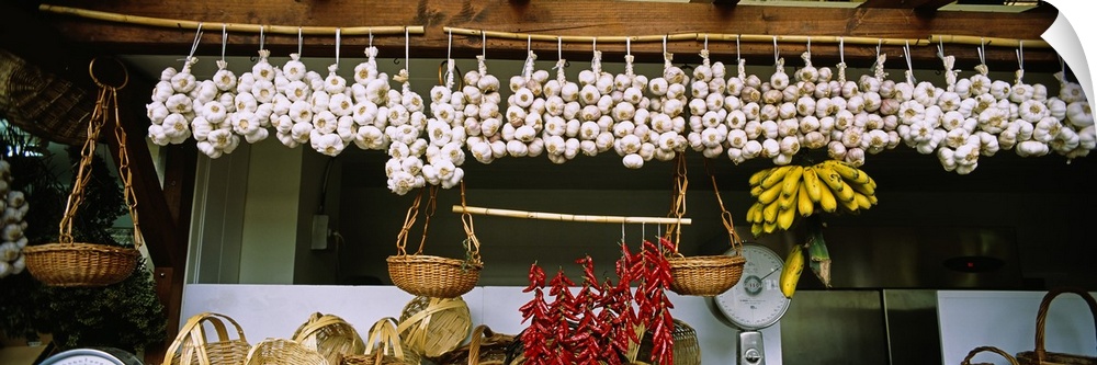 Red chili peppers and garlic hanging in a market, Funchal, Madeira, Portugal