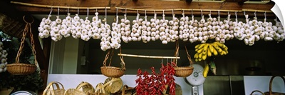 Red chili peppers and garlic hanging in a market, Funchal, Madeira, Portugal