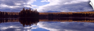 Reflection of clouds and trees in water, Little Bitterroot Lake, Montana
