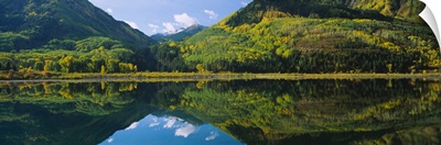 Reflection of mountains and aspen trees in water near Marble, Colorado