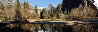 Reflection of mountains and trees in a lake, Half dome, Yosemite National Park, California