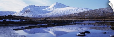 Reflection of snow covered mountains in a lake, Black Mount, Lochan Na h'Achlaise, Rannoch Moor, Highlands Region, Scotland