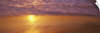 Reflection of sun in water on the beach, La Jolla, California